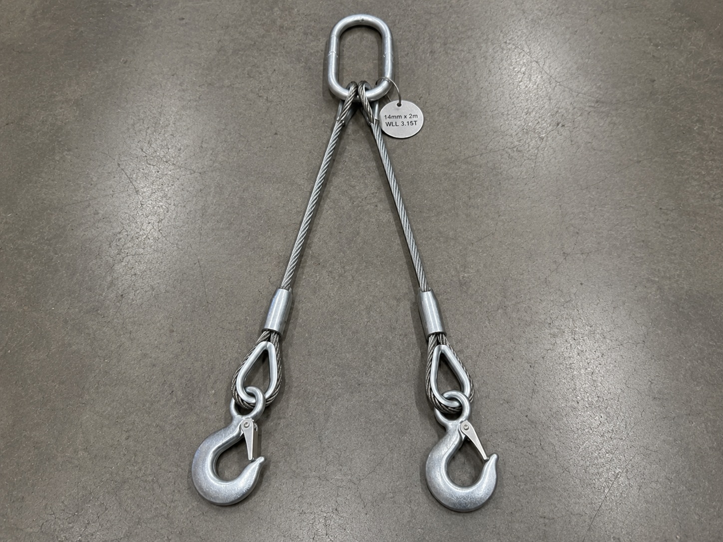 2 Leg Wire Rope Sling 14mm x 2m WLL 3.15T with Hooks 2 leg wire rope sling 14mm x 2m WLL 3.15T with master link hooks thimble eyes swaged sleeves and metal tag