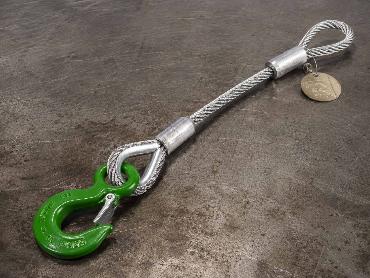 Wire rope lifting sling with thimble eyes swaged sleeves hooks and metal tags for industrial rigging